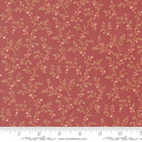a red fabric with small flowers on it