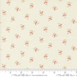 a close up of a white fabric with red flowers on it