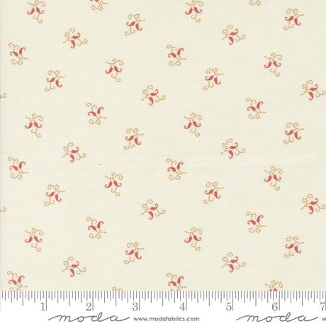 a close up of a white fabric with red flowers on it