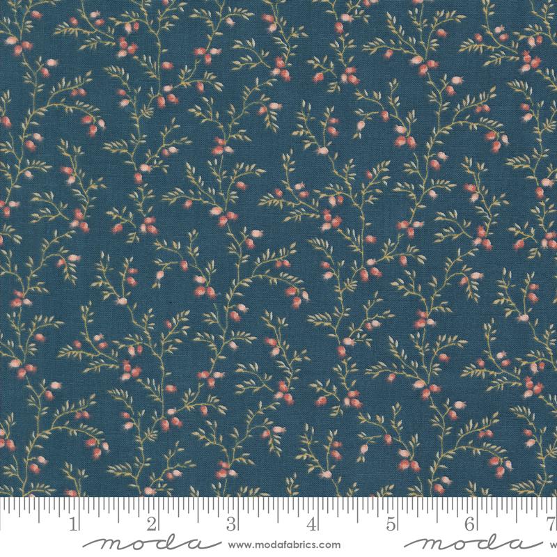 a blue fabric with small red berries on it