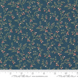 a blue fabric with small red berries on it