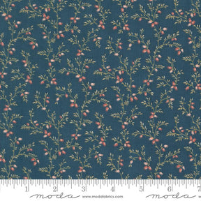 a blue fabric with small red berries on it