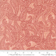a red paisley print fabric with a ruler