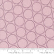 a pink background with circles and dots