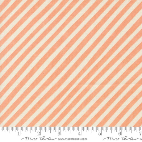 an orange and white striped fabric with a ruler