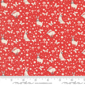 a red background with white rabbits and mushrooms