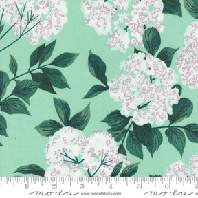 a green background with white flowers and green leaves