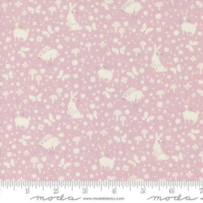 a pink and white fabric with white polka dots