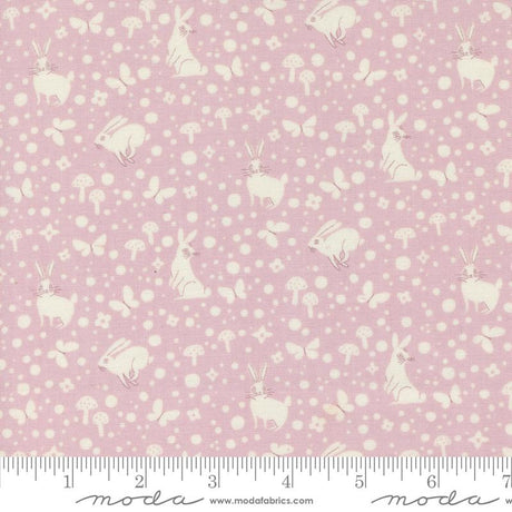 a pink and white fabric with white polka dots
