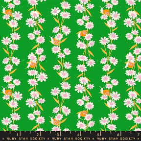 a green background with pink and white flowers