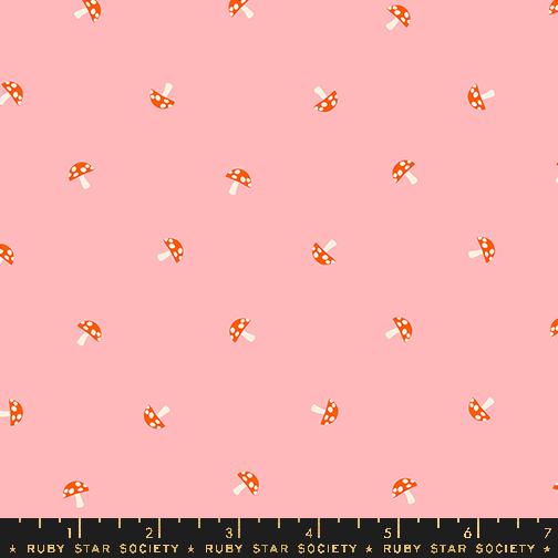 a pink background with orange and white polka dots