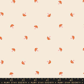a ruler with a pattern of small red objects on it