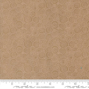 a ruler is next to a brown background