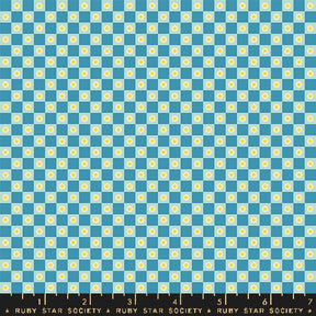 a blue and white checkered pattern with yellow dots