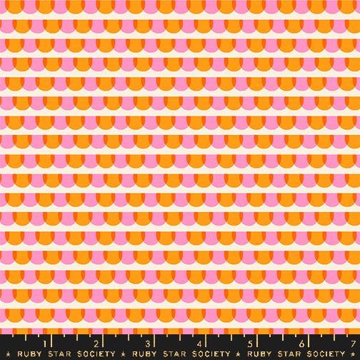 a ruler with an orange and pink pattern on it