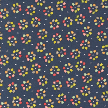 a blue background with multicolored flowers on it