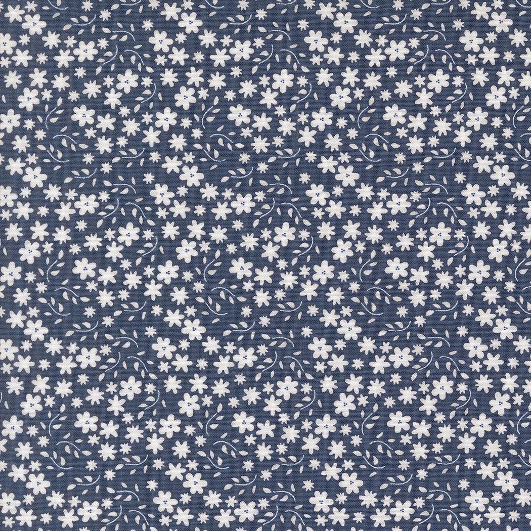 a blue and white background with white flowers