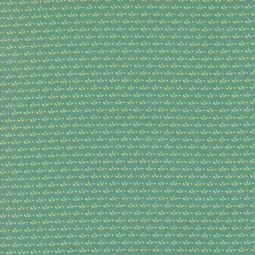 a green background with small white leaves
