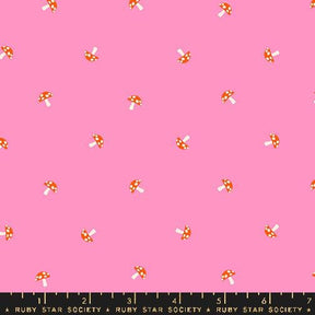 a pink background with red and white polka dots