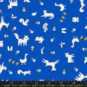 a blue background with white cats and flowers