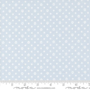 a ruler with a blue background with white polka dots
