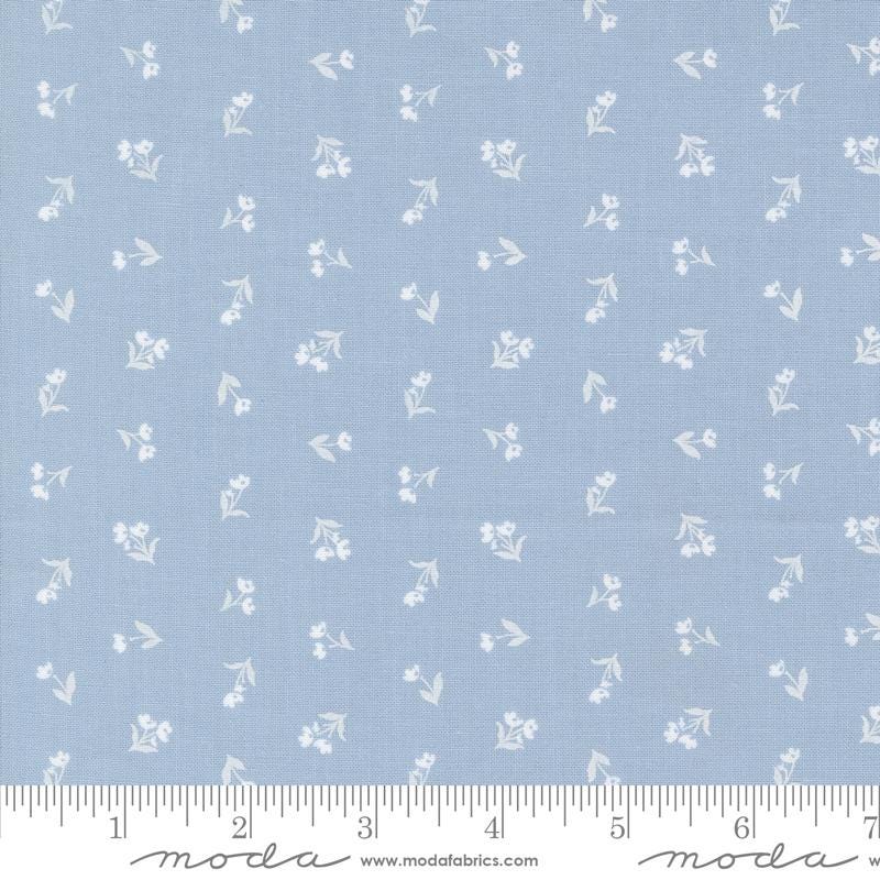 a blue fabric with white flowers on it