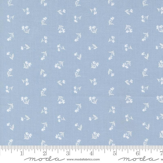 a blue fabric with white flowers on it