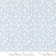 a white and blue flower pattern on a light blue background