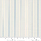 a white and blue striped wallpaper with a ruler