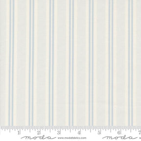 a white and blue striped wallpaper with a ruler