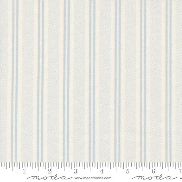 a white and blue striped wallpaper with a ruler