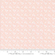 a pink background with white flowers on it