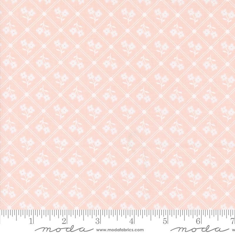 a pink background with white flowers on it