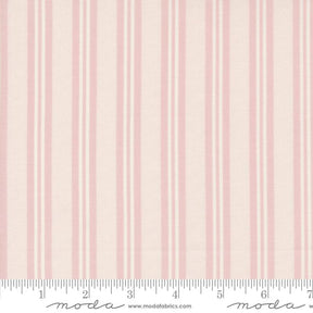 a pink and white striped wallpaper with a ruler