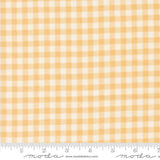 a yellow and white checkered fabric with a ruler