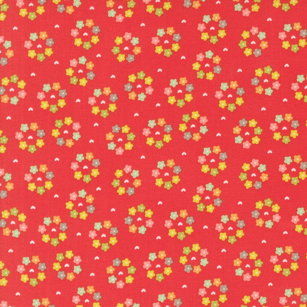 a red background with small colorful flowers on it