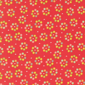 a red background with small colorful flowers on it