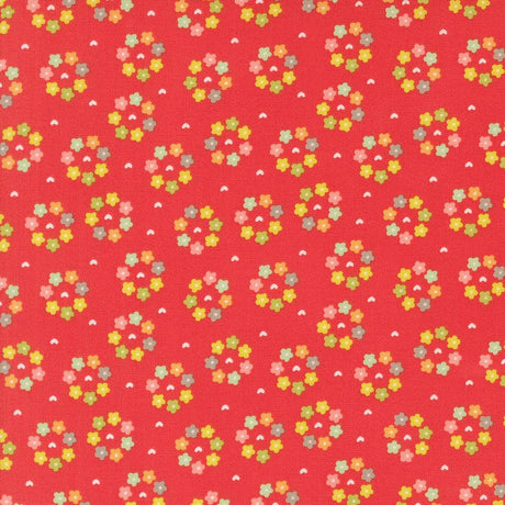 a red background with small colorful flowers on it