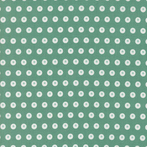 a green background with white dots
