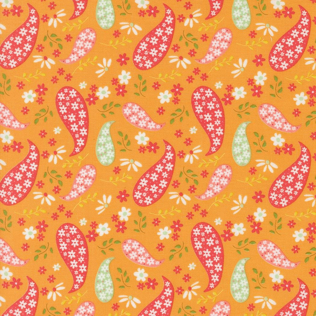 an orange background with a pattern of birds and flowers
