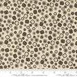 a white and brown pattern with black dots