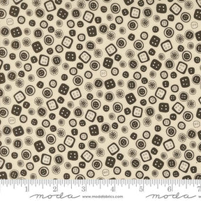 a white and brown pattern with black dots