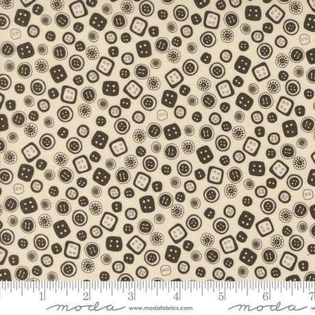 a white and brown pattern with black dots