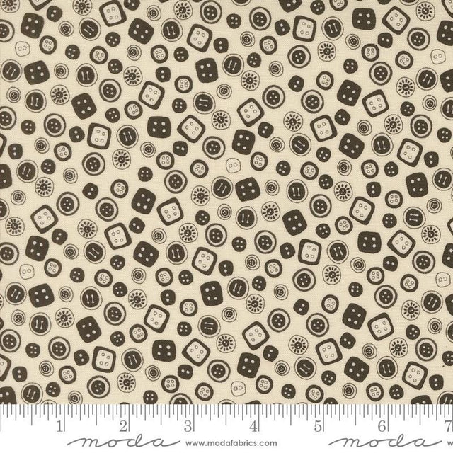 a white and brown pattern with black dots