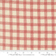 a red and white checkered fabric with a ruler