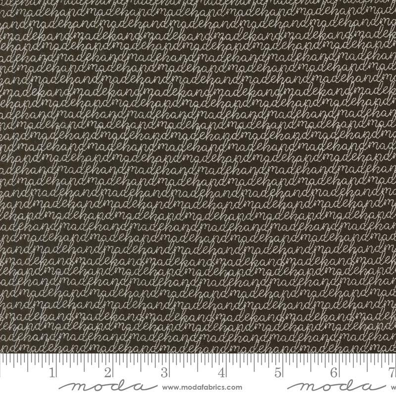a ruler with a brown and white background