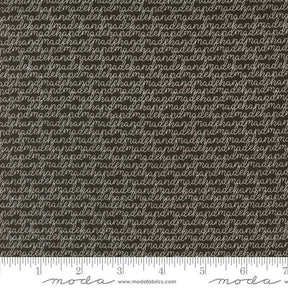 a ruler with a brown and white background