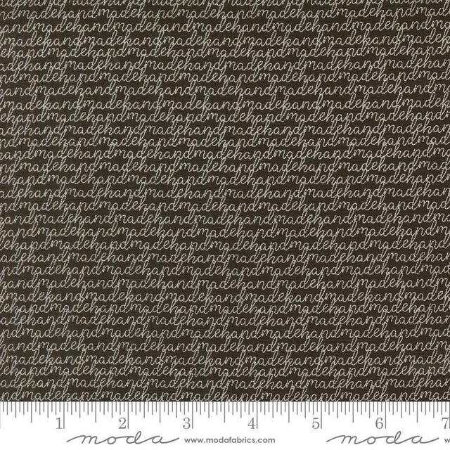 a ruler with a brown and white background