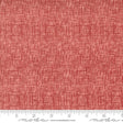 a red fabric with a ruler in front of it