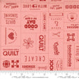 a pink fabric with red and white words on it